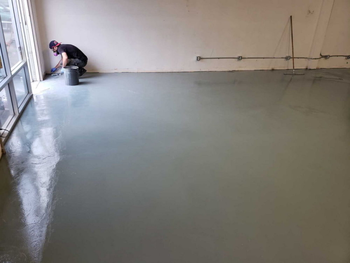 Concrete resurfacing and epoxy floor coating at Jusu Body