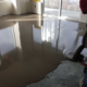 A professional pouring epoxy floor coating
